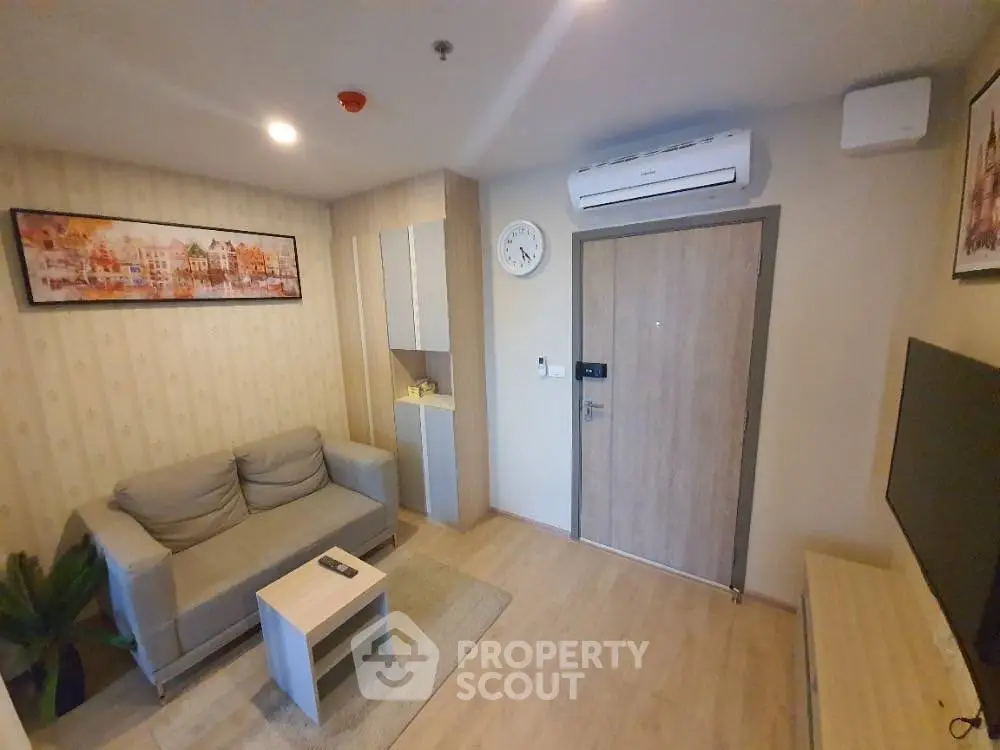 Cozy living room with modern decor and air conditioning in a stylish apartment.