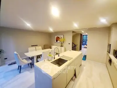 Spacious modern kitchen with open layout and elegant dining area