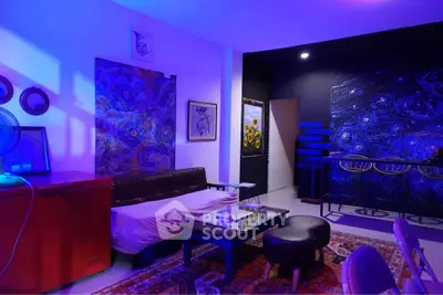 Stylish living room with vibrant art and modern furniture, perfect for creative urban living.