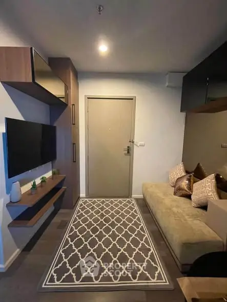 Modern living room with stylish decor and wall-mounted TV, perfect for cozy relaxation.