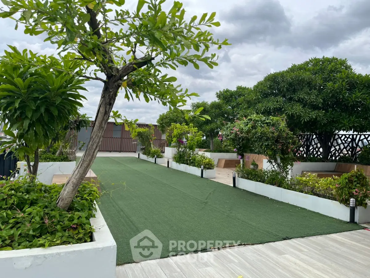 Luxurious rooftop garden with lush greenery and serene ambiance, perfect for relaxation and gatherings.