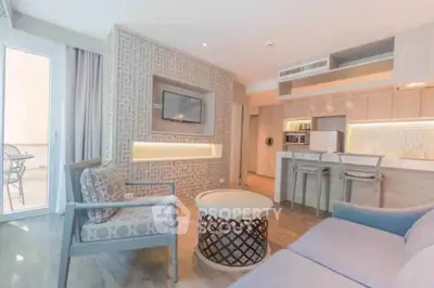 Modern open-plan living room with stylish kitchen and balcony access