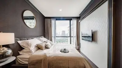 Luxurious bedroom with city view and elegant decor in modern apartment