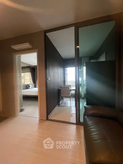 Modern apartment interior with glass partition and cozy furnishings