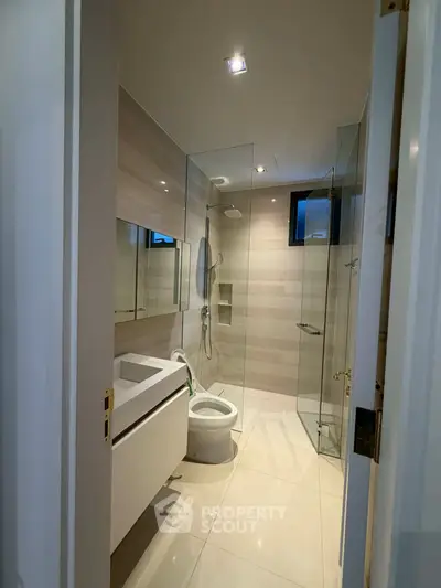 Modern bathroom with sleek design and glass shower enclosure