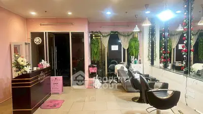 Chic salon interior with modern chairs, mirrors, and floral decor for a stylish ambiance.