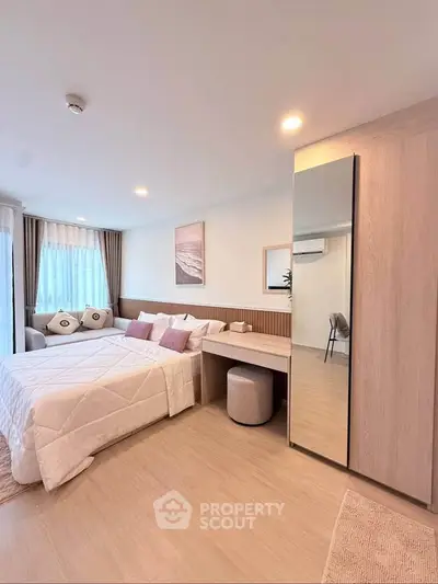 Modern bedroom with stylish decor and natural light