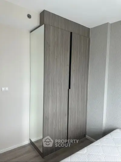 Modern bedroom with sleek built-in wardrobe and minimalist design
