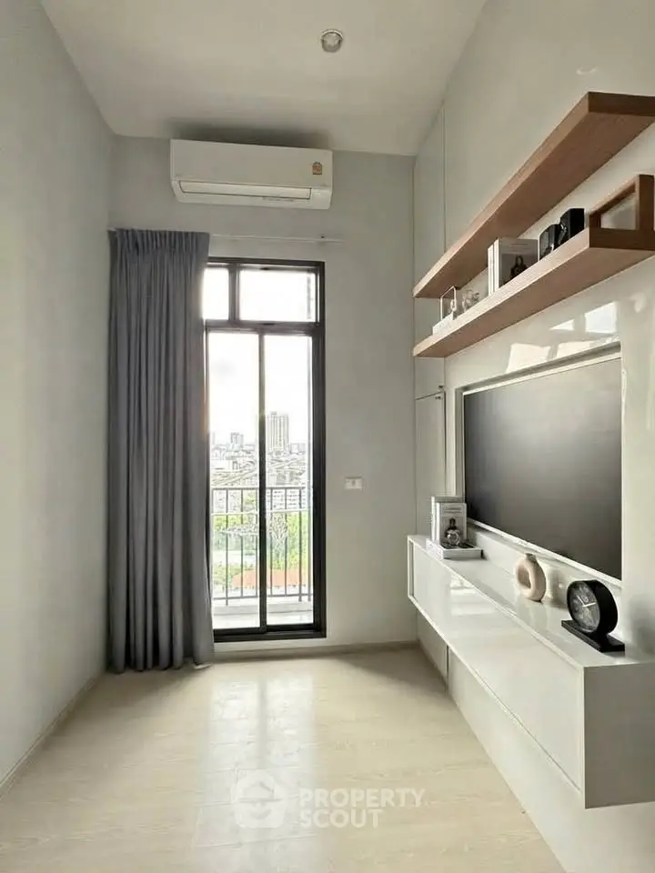 Modern living room with balcony view and sleek entertainment unit
