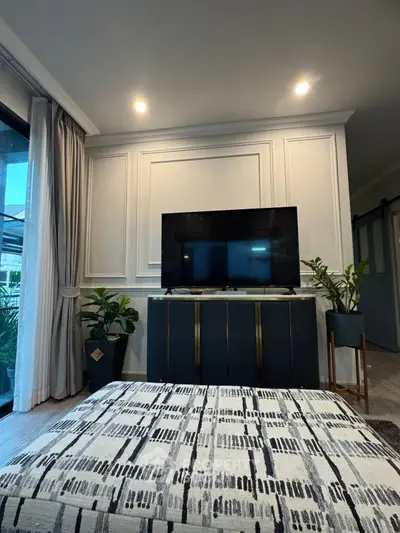 Stylish living room with modern TV setup and elegant decor