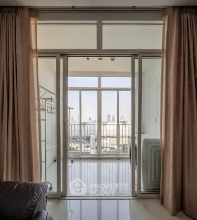 Spacious balcony with city view and elegant curtains in modern apartment
