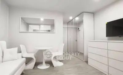 Modern minimalist living room with sleek white furniture and ample storage space.