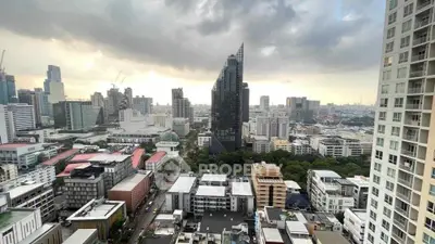 Stunning cityscape view from high-rise building showcasing urban skyline and modern architecture.