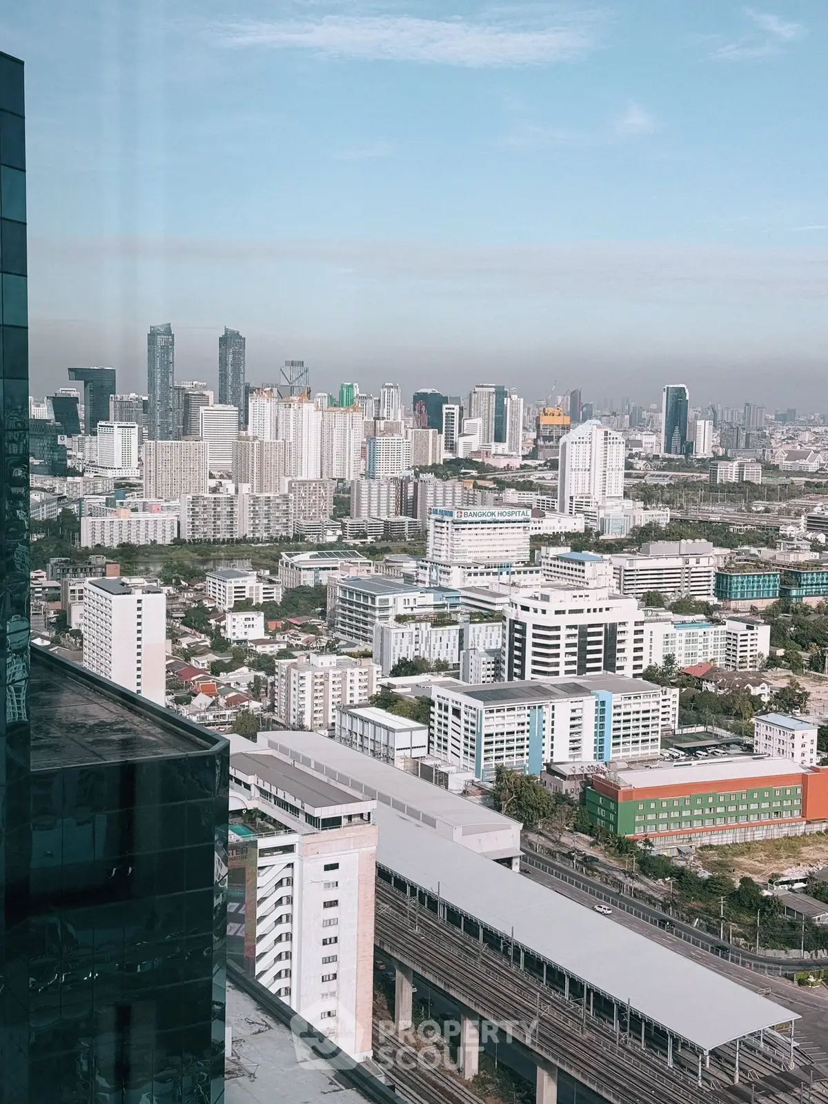 Stunning cityscape view from high-rise building showcasing urban skyline and architecture.