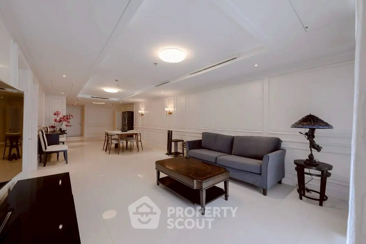 Elegant living room with modern furniture and stylish decor in a spacious open layout.