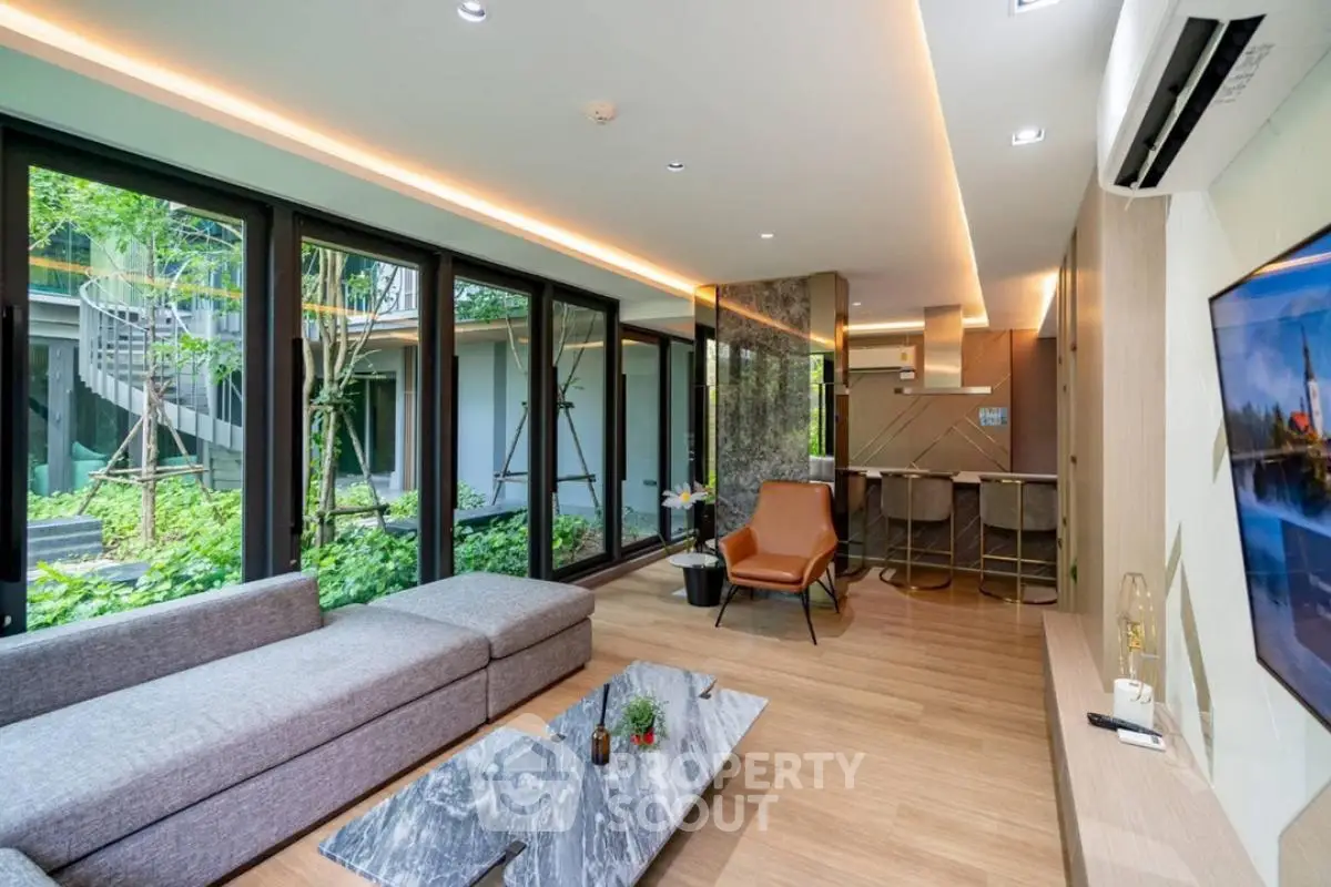Luxurious modern living room with garden view and stylish decor