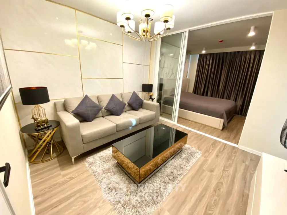 Luxurious modern living room with elegant decor and cozy bedroom view
