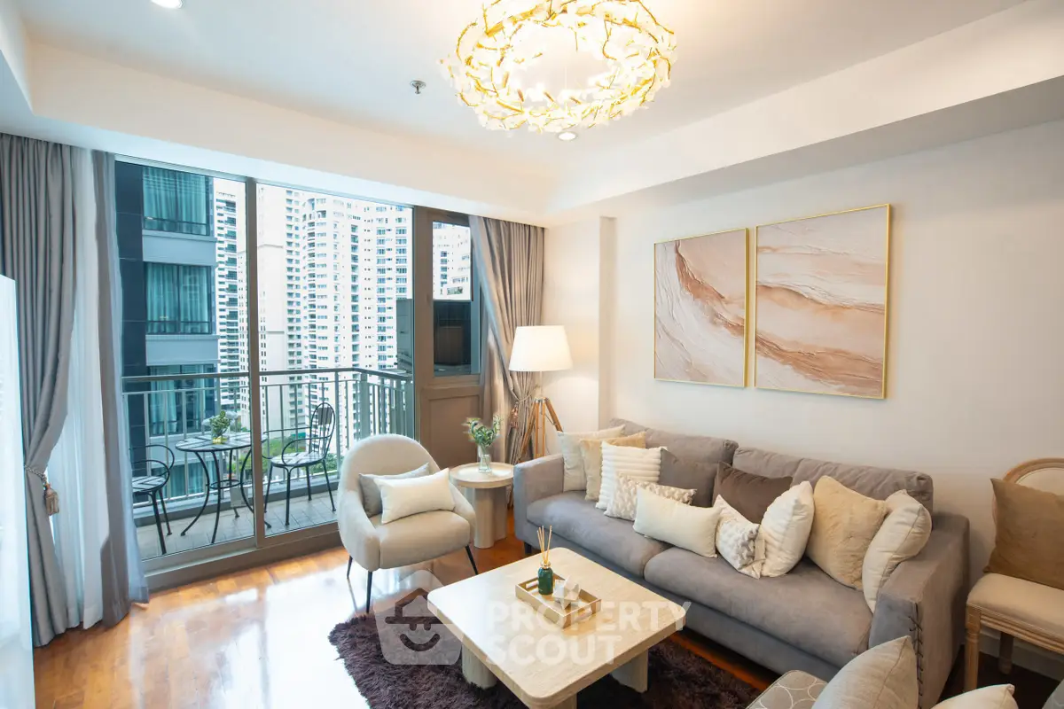 Luxurious living room with elegant decor and large balcony in modern high-rise apartment.
