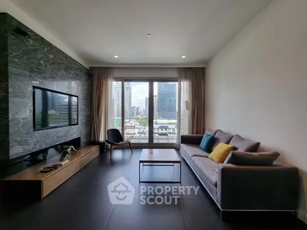 Modern living room with city view, stylish furniture, and large windows.