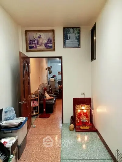 Cozy living space with religious decor and comfortable seating area