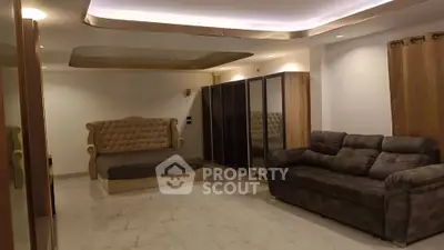 Luxurious living room with elegant furniture and modern lighting