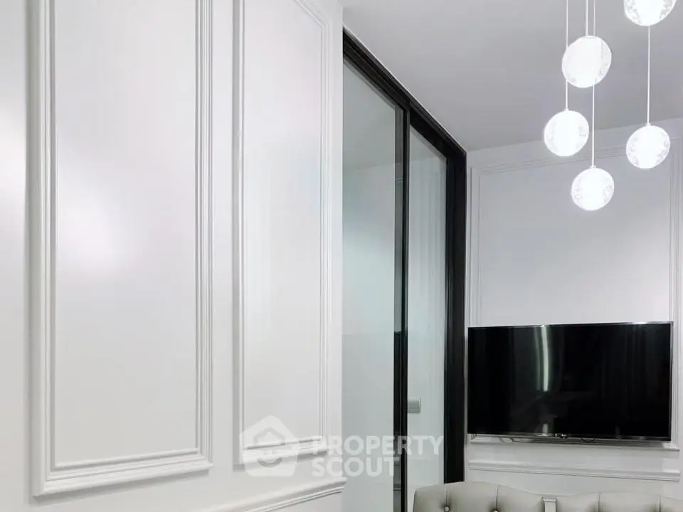 Modern living room with elegant paneling and sleek TV setup