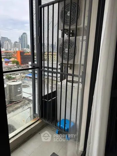 Urban balcony with city view and air conditioning units