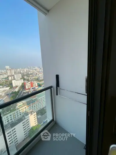 High-rise balcony with stunning cityscape view, perfect for urban living enthusiasts.