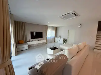 Spacious modern living room with elegant decor and natural light