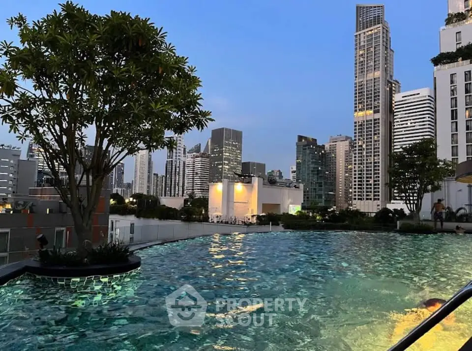Stunning rooftop pool with city skyline view at dusk, perfect for luxury urban living.