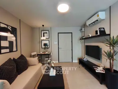 Modern living room with stylish decor and air conditioning