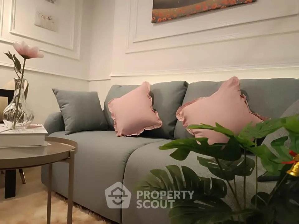 Chic living room with elegant sofa and stylish decor, perfect for modern urban living.