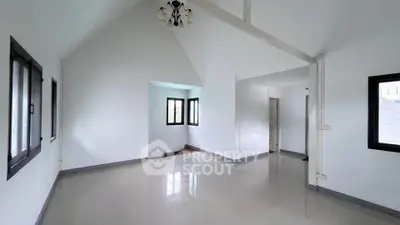 Spacious and bright empty room with high ceilings and modern windows