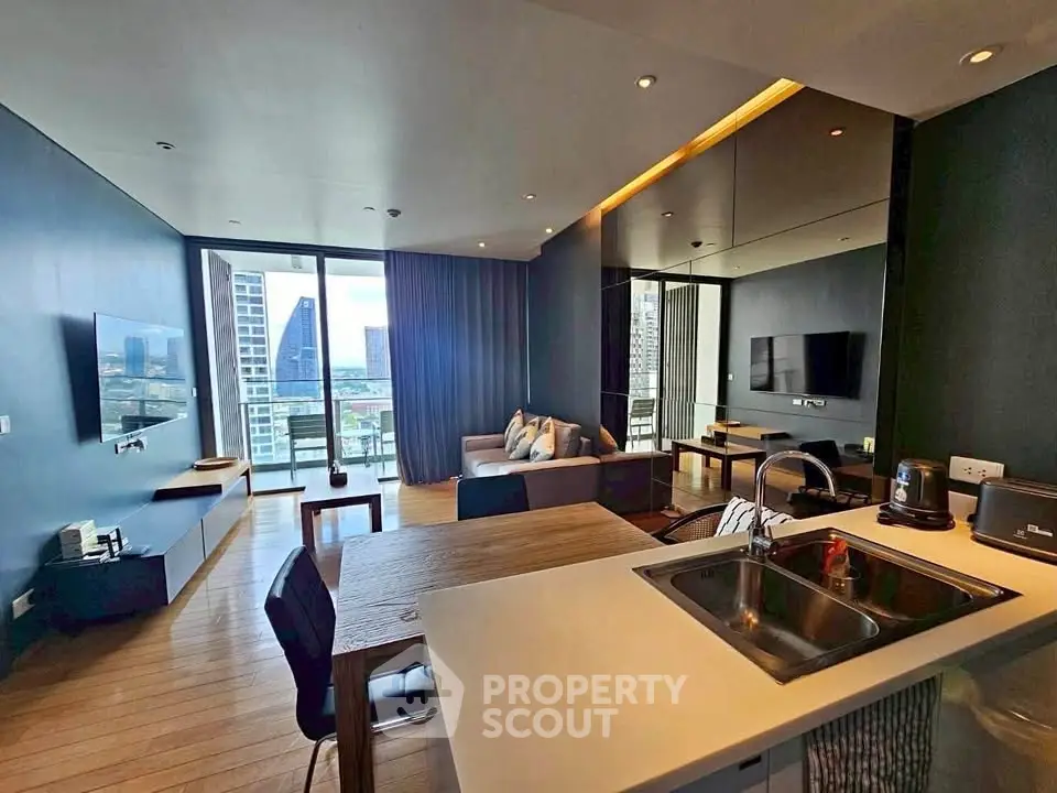 Modern open-plan living room with city view, sleek kitchen, and stylish decor in high-rise apartment.