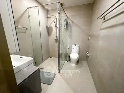 Modern bathroom with glass shower and sleek fixtures