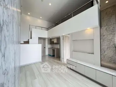 Modern loft-style living room with high ceilings and sleek design