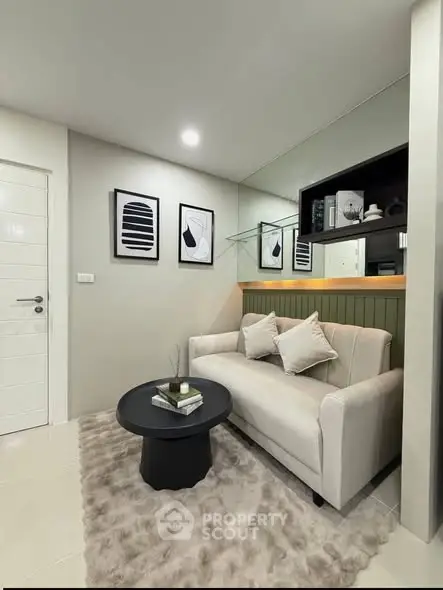 Cozy living room with modern decor and plush rug, perfect for relaxation.