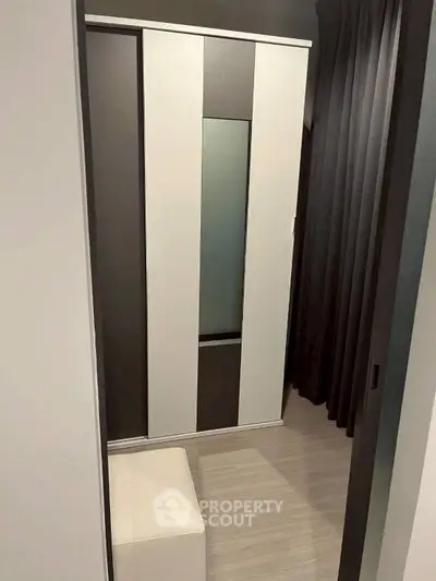 Modern interior with sleek wardrobe and minimalist design, perfect for contemporary living spaces.