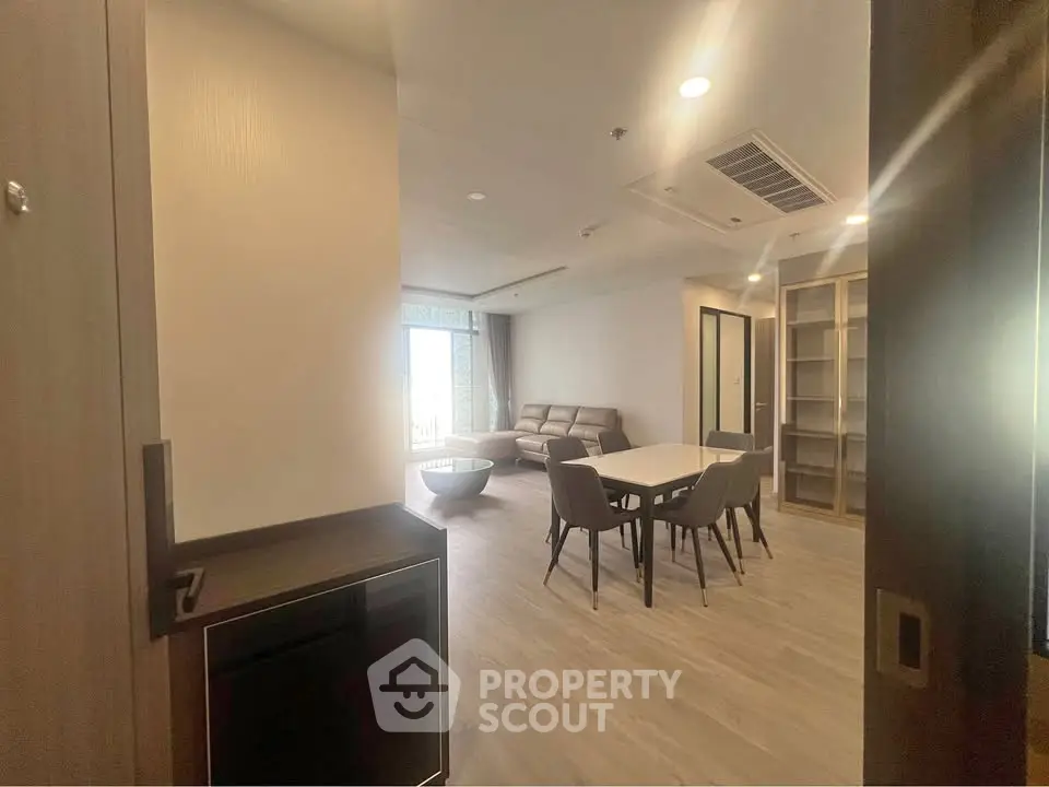 Spacious modern living room with dining area and natural light