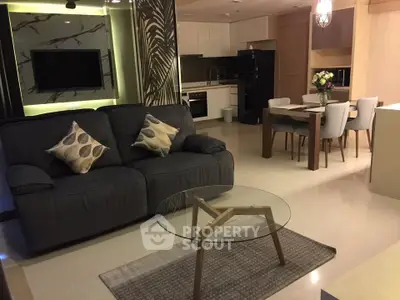 Luxurious open-plan living room with modern kitchen and elegant dining area, perfect for entertaining.