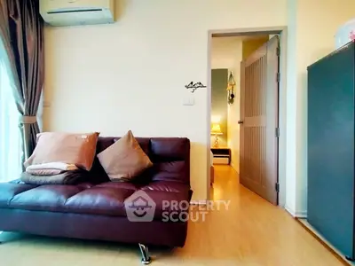 Cozy living room with brown leather sofa and modern decor