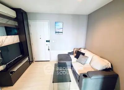Modern living room with sleek furniture and stylish decor, perfect for urban living.