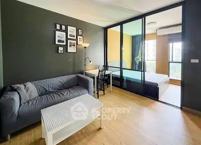 Modern studio apartment with stylish living room and cozy bedroom