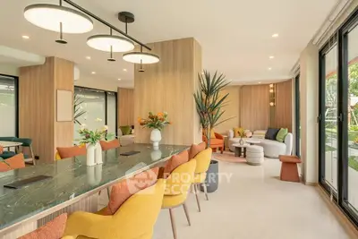 Luxurious modern living room with elegant decor and vibrant seating, perfect for entertaining guests.