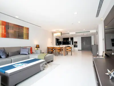 Spacious modern living room with open kitchen and stylish decor