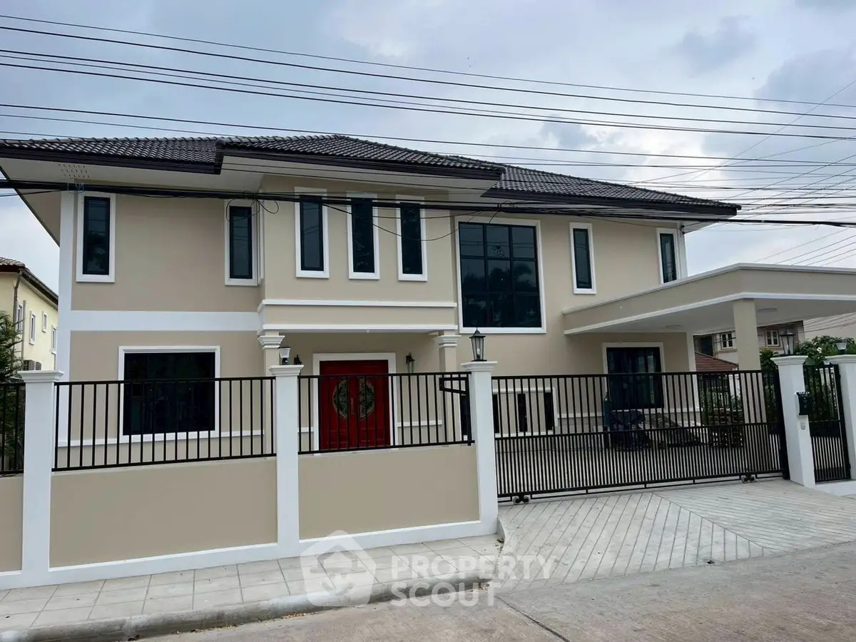 Stunning two-story modern house with elegant facade and spacious driveway in a serene neighborhood.
