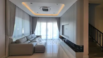 Luxurious modern living room with sleek design and large windows