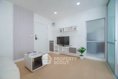 Modern living room with sleek design, featuring a TV unit, stylish coffee table, and elegant decor.