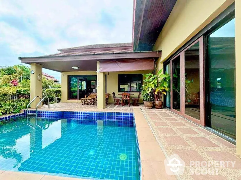 Luxurious villa with private pool and spacious patio in tropical setting