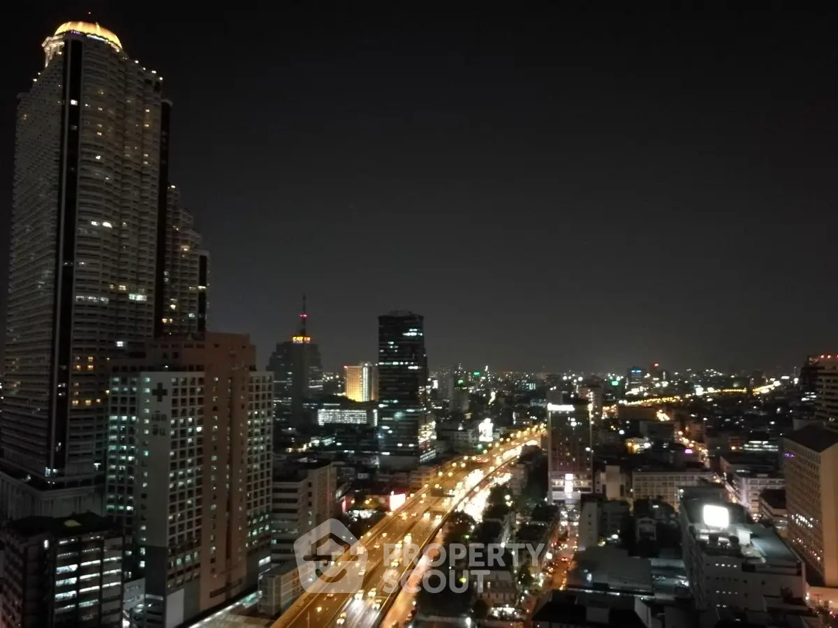 Stunning night cityscape view from high-rise building balcony